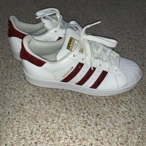 Adidas superstar with burgundy accents